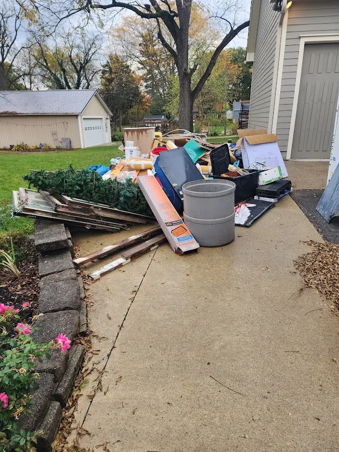 Dumpster being loaded with debris for Residential Dumpster Rental in Grottoes
